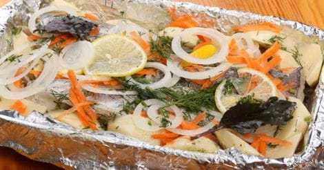 Preparation a marinated hake with potatoes for baking in the oven