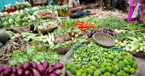 Indian man at his vegetable shop