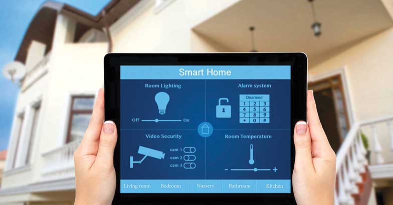 Female hands hold a tablet with system smart house on the backgr Female hands hold a tablet with system smart house on the backgr
