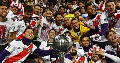 Players of River Plate celebrate with the trophy