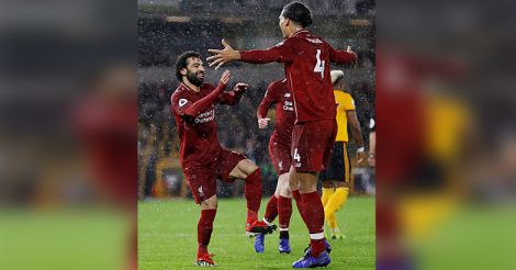 Mohamed Salah celebrates their first goal with Virgil van Dijk