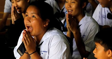 Classmates pray for the schoolboys trapped inside thai cave