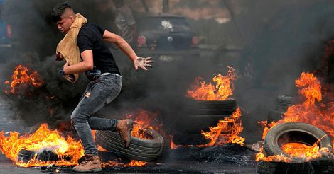 Palestinians protesters during clashes with Israeli security forces 