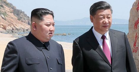 Xi Jinping walks with Kim Jong Un 