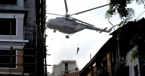 In this file photo taken on November 28, 2008 an Indian comando rappels from a helicopter during an operation at Nariman House in Mumbai.