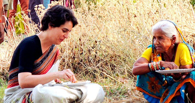 Priyanka Vadra shares meal with a village woman Priyanka Vadra shares meal with a village woman