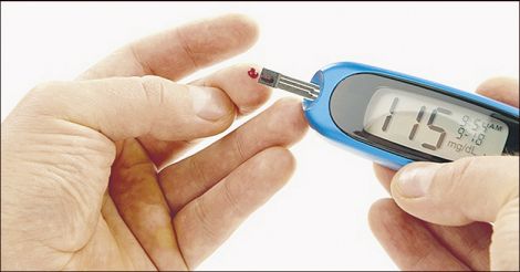 Diabetic patient doing glucose level blood test
