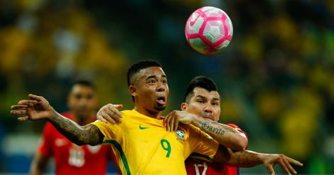 Gabriel Jesus (L) of Brazil and Gary Medel of Chile in action during the match between Brazil and Chile for the 2018 FIFA World Cup Russia Qualifier