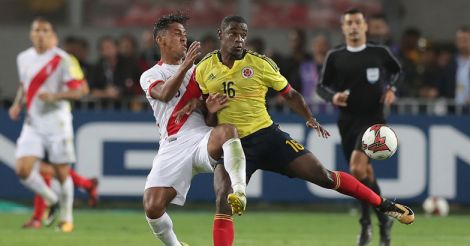 Renato Tapia of Peru fights for the ball with Duvan Zapata of Colombia during a match between Peru and Colombia as part of FIFA 2018 World Cup Qualifiers 