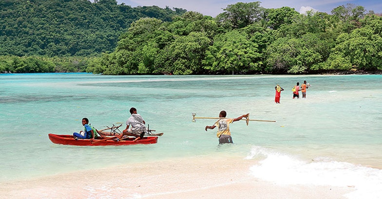 Local boys crossing to Malet island. Port Olry-Espiritu Santo is Local boys crossing to Malet island. Port Olry-Espiritu Santo is
