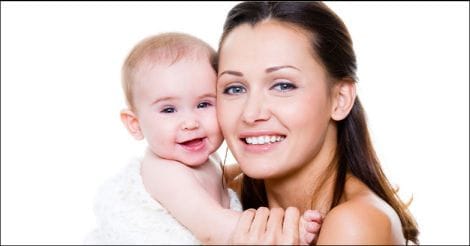 Happy mother with smiling baby