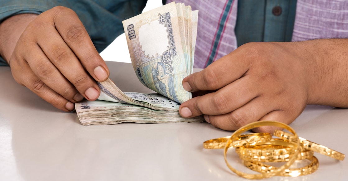 163997513 Mid section view of a man counting money