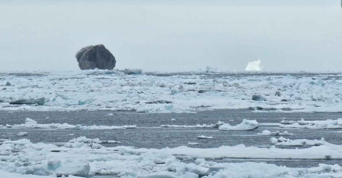 Mysterious Black Iceberg Stuns Canada: What's Behind the Unusual Sight? Image Credit: Hallur Antoniussen/ Facebook