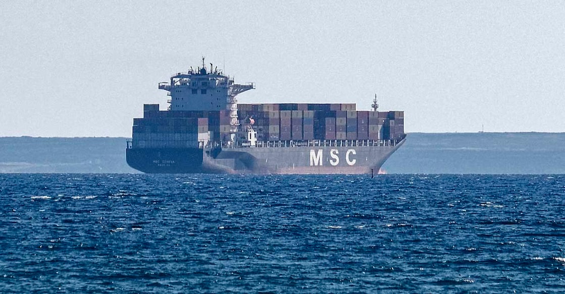 This picture taken on March 30, 2021 shows a view of the Germany-flagged container cargo ship MSC Geneva off the coast of Cyprus' southern city of Limassol. (Photo by Amir MAKAR / AFP)