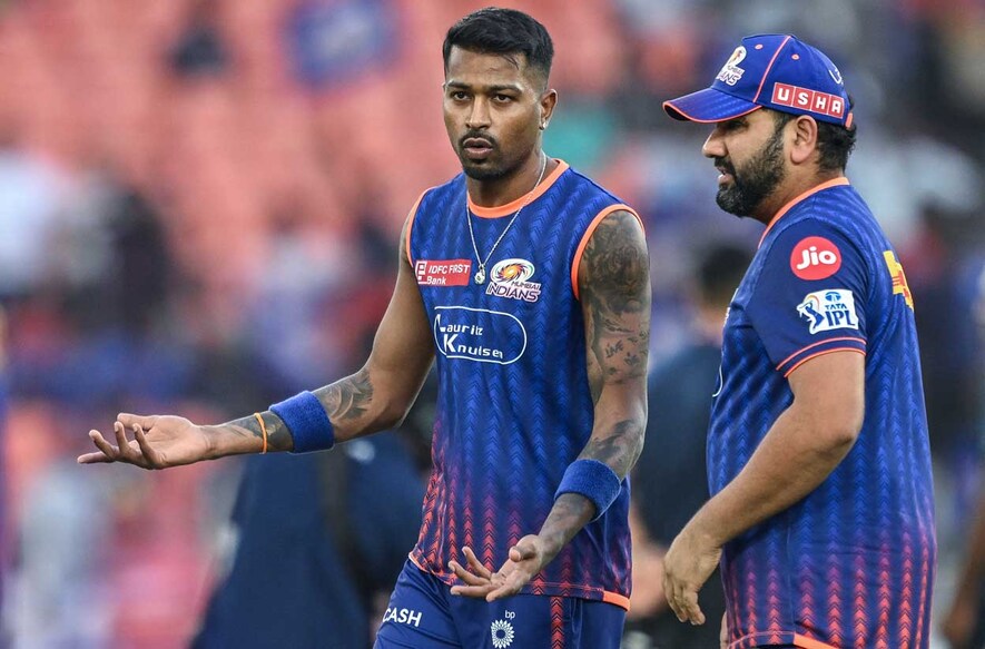 Mumbai Indians' skipper  Hardik Pandya (L) speaks with his teammate Rohit Sharma during lukewarm  up   earlier  the commencement  of the Indian Premier League (IPL) Twenty20 2nd  Qualifier cricket lucifer  betwixt  Punjab Kings and Mumbai Indians astatine  the Narendra Modi Stadium successful  Ahmedabad connected  June 1, 2025. (Photo by Arun SANKAR / AFP) / -- IMAGE RESTRICTED TO EDITORIAL USE - STRICTLY NO COMMERCIAL USE --