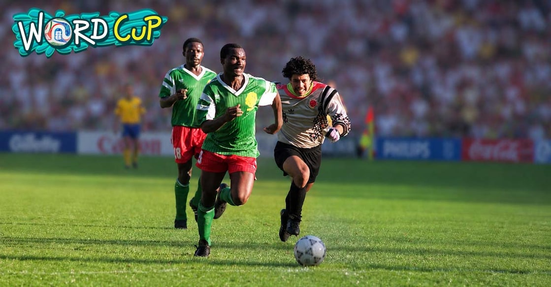 Cameroon player Roger Milla scores a goal past the Colombian goalkeeper in the 1990 World Cup match. (Photo by AFP)