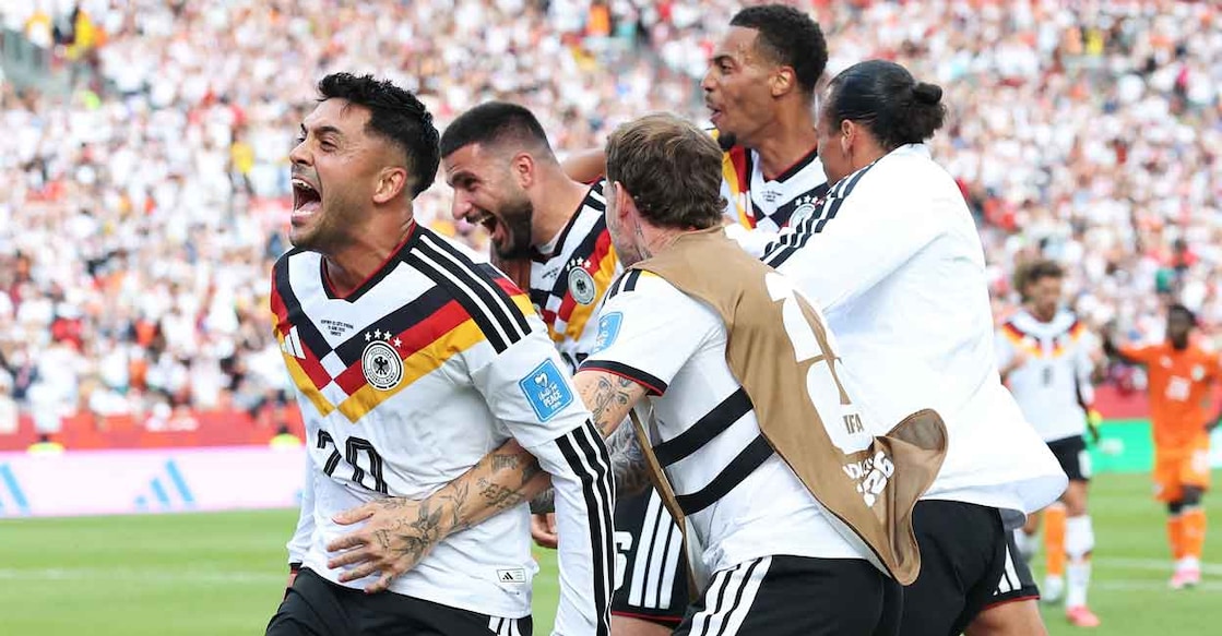 Germany's Denis Undau and his teammates celebrate after scoring a goal against Ivory Coast in the FIFA World Cup. (Photo by ALEXANDER HASSENSTEIN / GETTY IMAGES NORTH AMERICA / Getty Images via AFP)