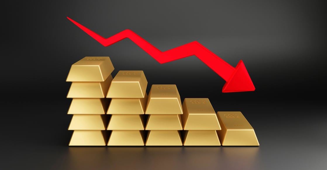2161766497 Gold bars stack with red down arrow 3D rendering