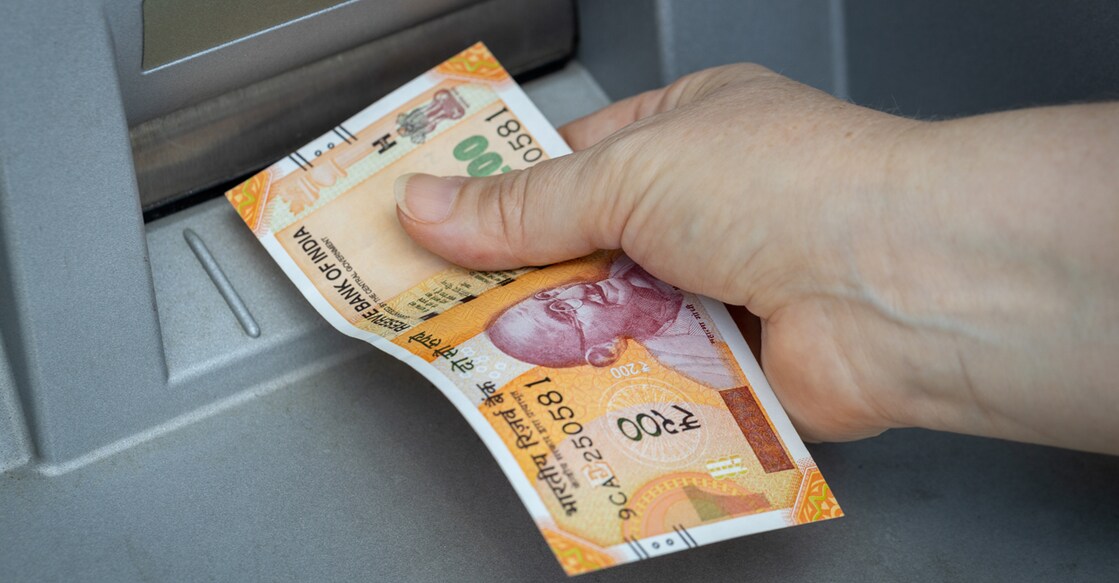 Indian rupees withdrawn from the ATM, Financial and economic concept related to inflation and rising cost of living, Declining value of money