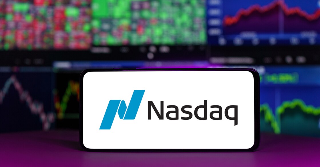 Vilnius, Lithuania - 2023 April 21: nasdaq stock market index in front of stock market charts background. High quality photo