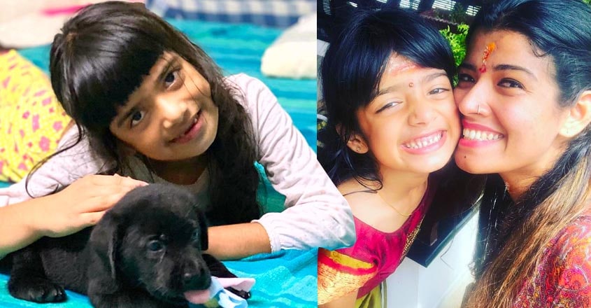 amritha-suresh-post-photos-of-daughter-avanthika-with-pet-dog amritha-suresh-post-photos-of-daughter-avanthika-with-pet-dog