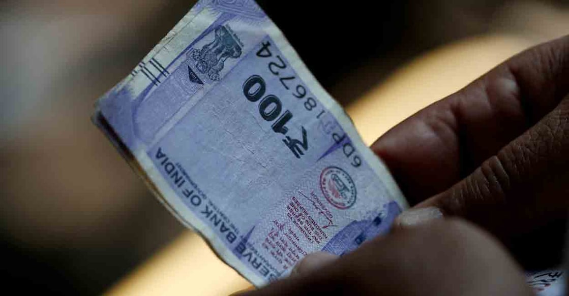 Indian Currency Note / Hundred Rupees | File Photo: REUTERS/Priyanshu Singh Indian Currency Note / Hundred Rupees | File Photo: REUTERS/Priyanshu Singh
