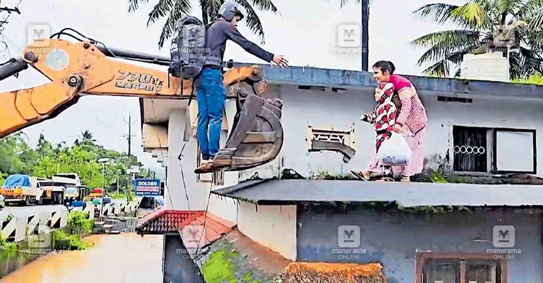 യന്ത്രക്കൈ സഹായം: ജോലി തേടി നേപ്പാളിൽ നിന്നു വയനാട്ടിലെത്തിയ ഹാരിഷും ഭാര്യ മായയും ഇന്നലെ നേരം പുലർന്നപ്പോൾ ഞെട്ടിപ്പോയി. മാനന്തവാടി-കൊയിലേരി റോഡരികിലായി വള്ളിയൂർക്കാവിനു സമീപത്തെ വാടകവീടിനു പിന്നിലൂടെ ഒഴുകിയിരുന്ന പുഴ വീടിനു ചുറ്റുമായി നിറഞ്ഞൊഴുകുന്നു. നാട്ടുകാർ ആദ്യം ഒന്നു പകച്ചെങ്കിലും സമീപത്തുണ്ടായിരുന്ന മണ്ണുമാന്തിയന്ത്രമെത്തിച്ചു വീട്ടിൽ കുടുങ്ങിയവരെയെല്ലാം സുരക്ഷിതരായി പുറത്തെത്തിച്ചു. രണ്ടാം നിലയിലുണ്ടായിരുന്ന ഹാരിഷ് (25), ഭാര്യ മായ (24), മകൻ പ്രശാന്ത്(4), മായയുടെ സഹോദരൻ റോഷൻ (20) എന്നിവരാണു യന്ത്രക്കയ്യിലേറി നിലം തൊട്ടത്.   
