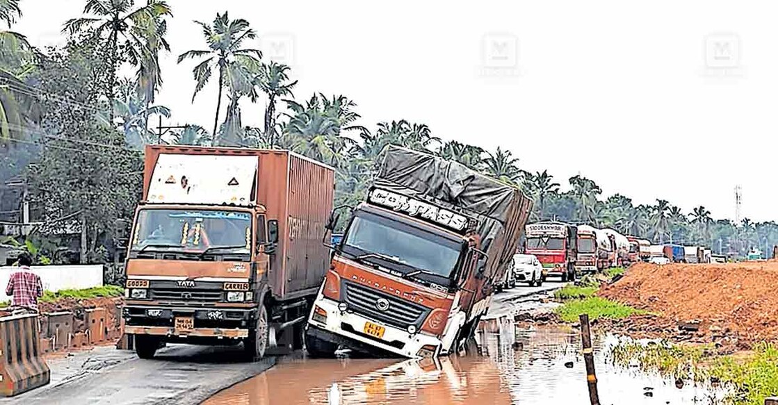 lorry-traffic-jam ദേശീയ പാതയിൽ തിരുവങ്ങൂരിൽ ലോറി ചെളിയിൽ താഴ്ന്നതിനെ തുടർന്നുള്ള ഗതാഗതക്കുരുക്ക്.