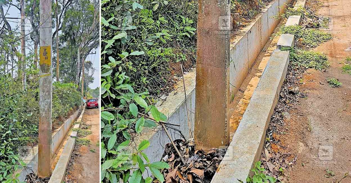 kalpatta-manathavadi-road-nh കൽപറ്റ – മാനന്തവാടി റോഡിൽ എരനെല്ലൂർ ക്ഷേത്രത്തിന് സമീപം വൈദ്യുത പോസ്റ്റ് മാറ്റാതെ കാനയുടെ പണി പൂർത്തീകരിച്ചപ്പോൾ.