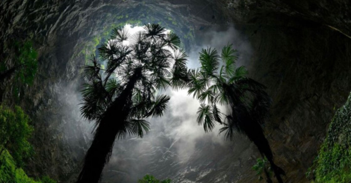 Giant sinkhole with a forest inside found in China Image Credit: Twitter