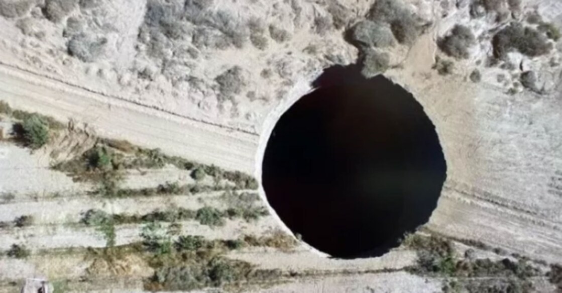 Enormous sinkhole wide enough to swallow the White House opens in Chile Image credit: Sernageomin/ Twitter
