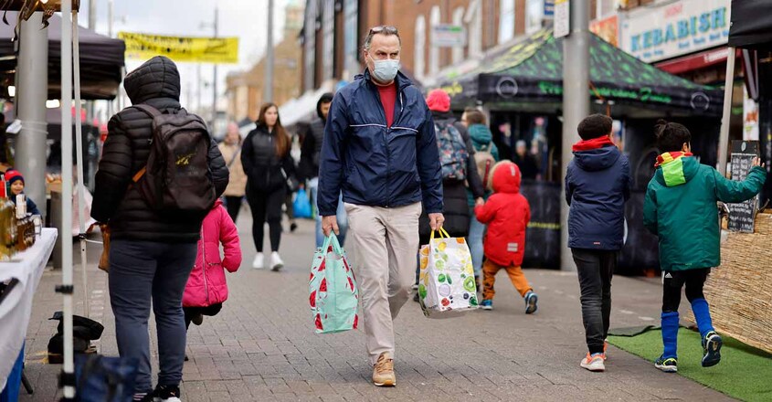 A shopper wearing a face covering to stop the spread of COVID-19