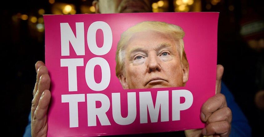 donald-trump-protestor-sign donald-trump-protestor-sign