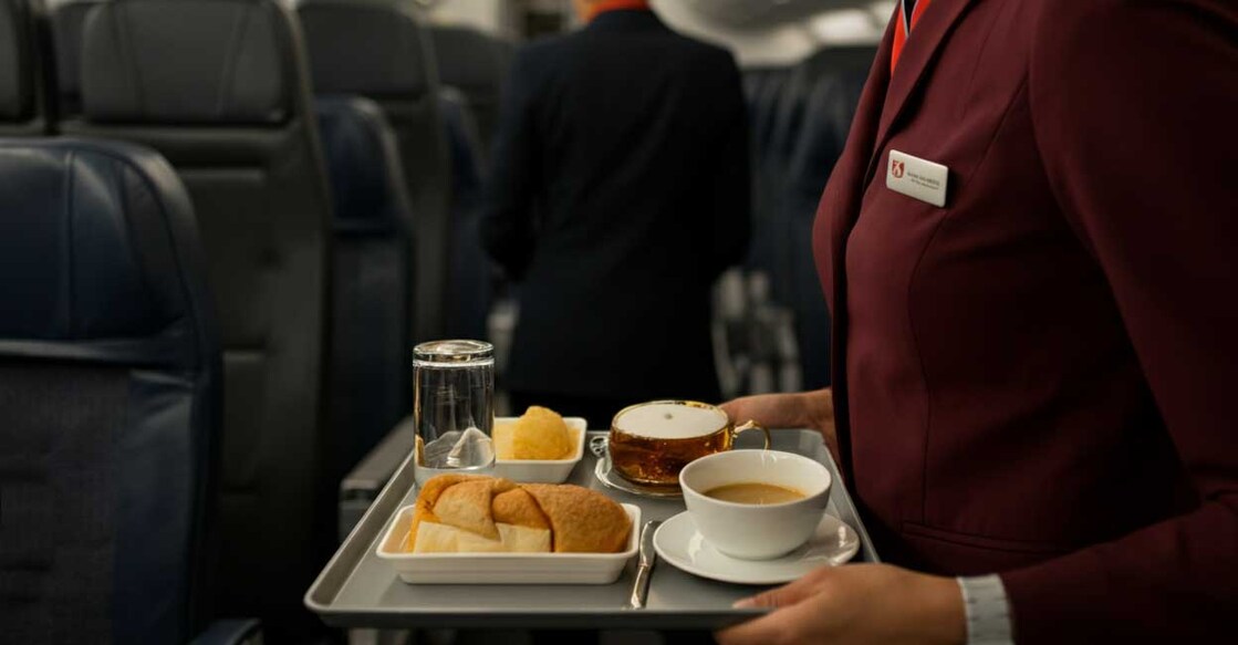 flight-attendant-served-child-white-wine Photo Credit: Representative image created using AI Image Generator