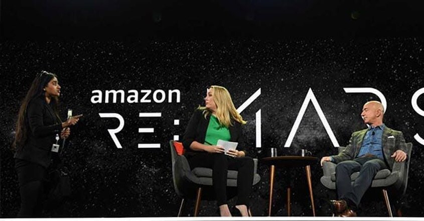priya-interupts-jeff-bezos priya-interupts-jeff-bezos