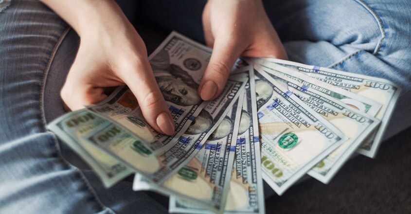 person-holding-money person-holding-money