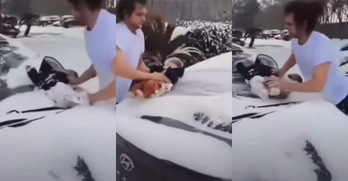 texas-man-uses-his-3-month-old-baby-as-wiper-to-clean-car-snow-in-viral-video വൈപ്പറായി കുഞ്ഞിനെ ഉപയോഗിക്കുന്ന വിഡിയോയിൽ നിന്ന്. Image Credit: X/SchengenStory