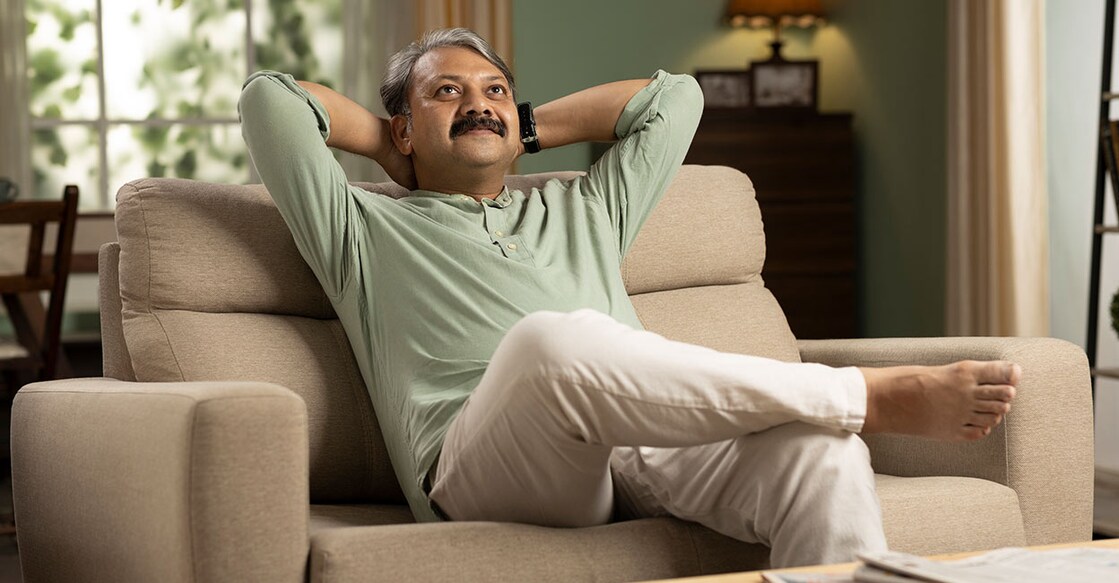 man-sitting-on-sofa-deepak-sethi-istock-photo-com