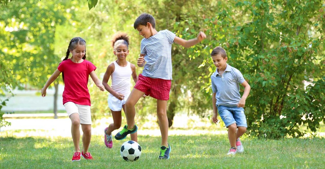 children-playing-football-park