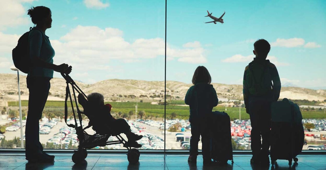 mother-kids-luggage-looking-planes-airpor mother-kids-luggage-looking-planes-airpor