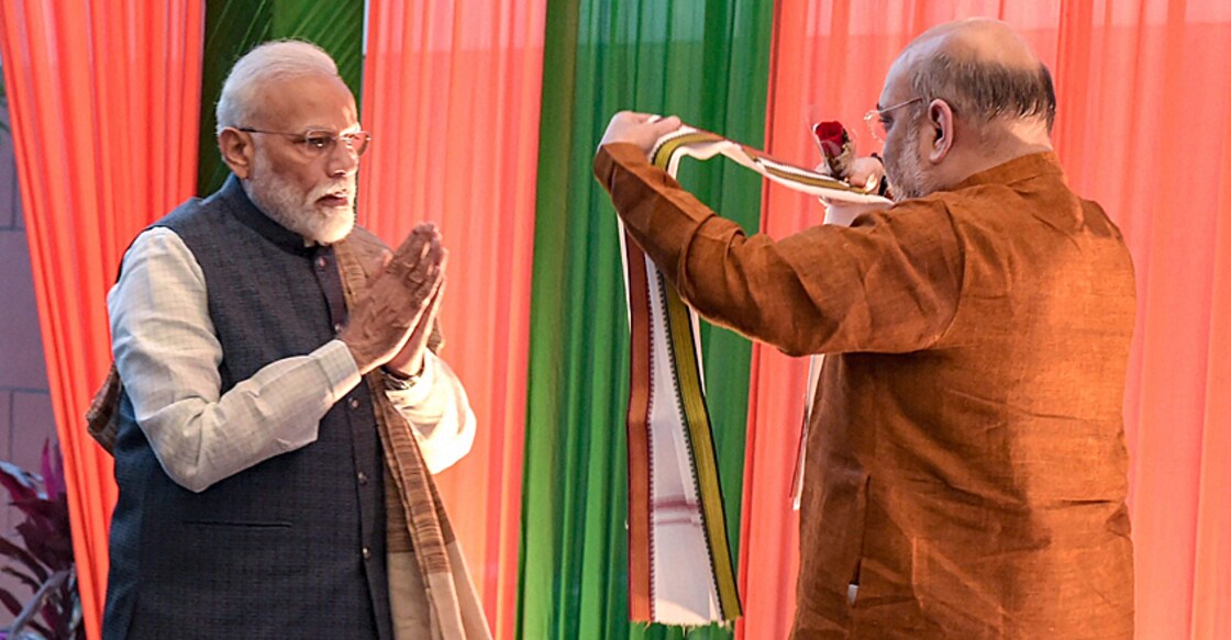 Narendra Modi being welcomed by Amit Shah