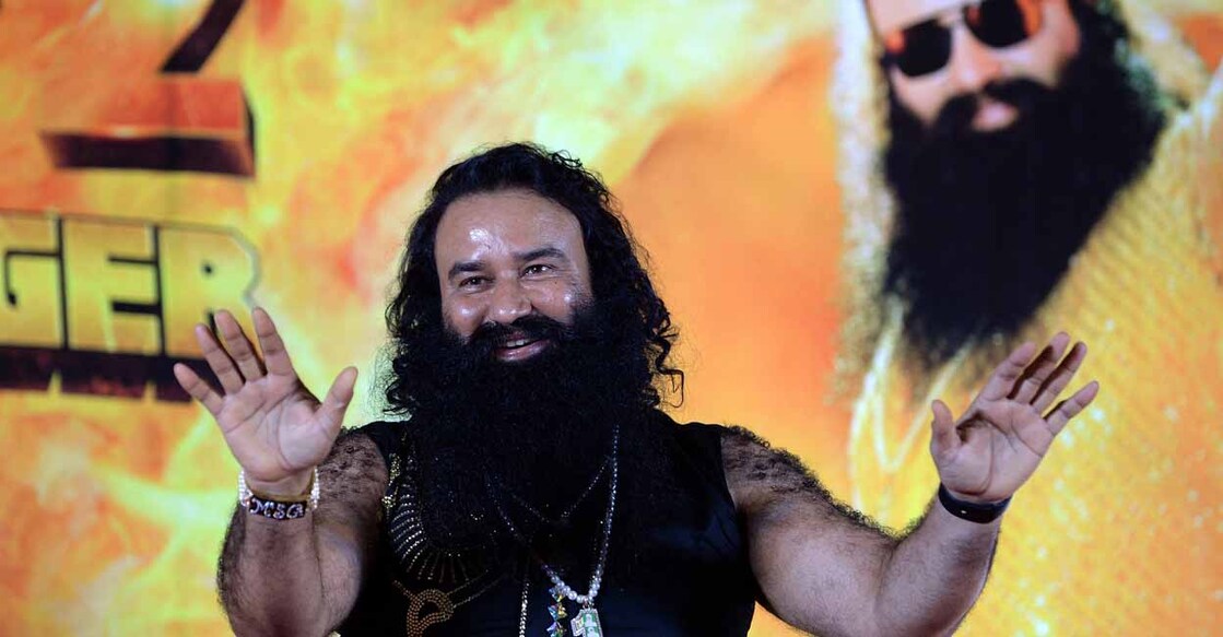 Indian chief of the religious sect Dera Sacha Sauda (DSS) Gurmeet Ram Rahim Singh gestures during a news conference to launch the score for his forthcoming film 'MSG-2 The Messenger' in Mumbai on September 8, 2015.  AFP PHOTO/ PUNIT PARANJPE (Photo by PUNIT PARANJPE / AFP)