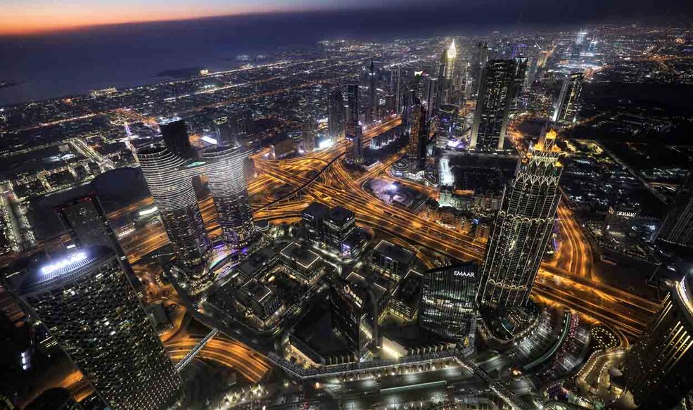 This picture taken on May 9, 2021 shows a view of the Dubai city skyline as seen from the Burj Khalifa, currently the world's tallest building at 828 metres. (Photo by Giuseppe CACACE / AFP)