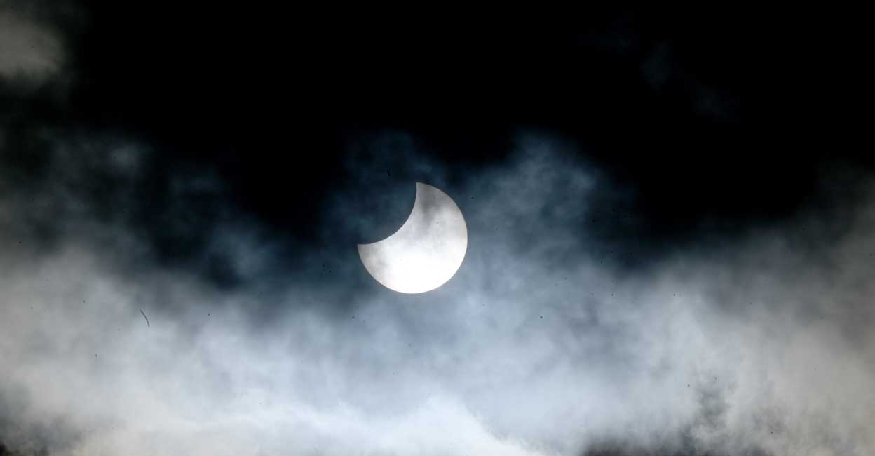 Partial Solar eclipse | Salzburg | Austria (Photo by BARBARA GINDL / APA / AFP) / Austria OUT