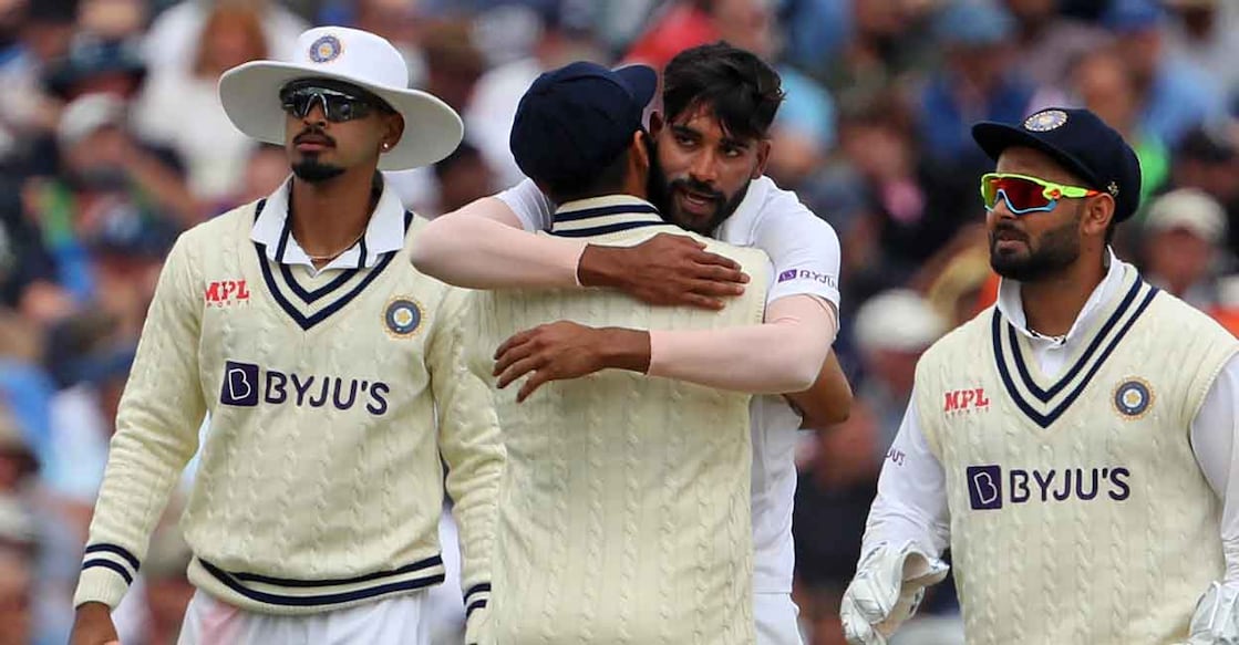 CRICKET-ENG-IND India's Mohammed Siraj (2nd R) celebrates with teammates after taking the wicket of England's Sam Billings during play on Day 3 of the fifth cricket Test match between England and India at Edgbaston, Birmingham in central England on July 3, 2022. - The match should have been played in Manchester last September but, hours before it was due to start, it was postponed because of Covid-19 concerns in the India camp. India take a 2-1 lead into this, the final match in the five-match series. (Photo by Geoff Caddick / AFP) / RESTRICTED TO EDITORIAL USE. NO ASSOCIATION WITH DIRECT COMPETITOR OF SPONSOR, PARTNER, OR SUPPLIER OF THE ECB
