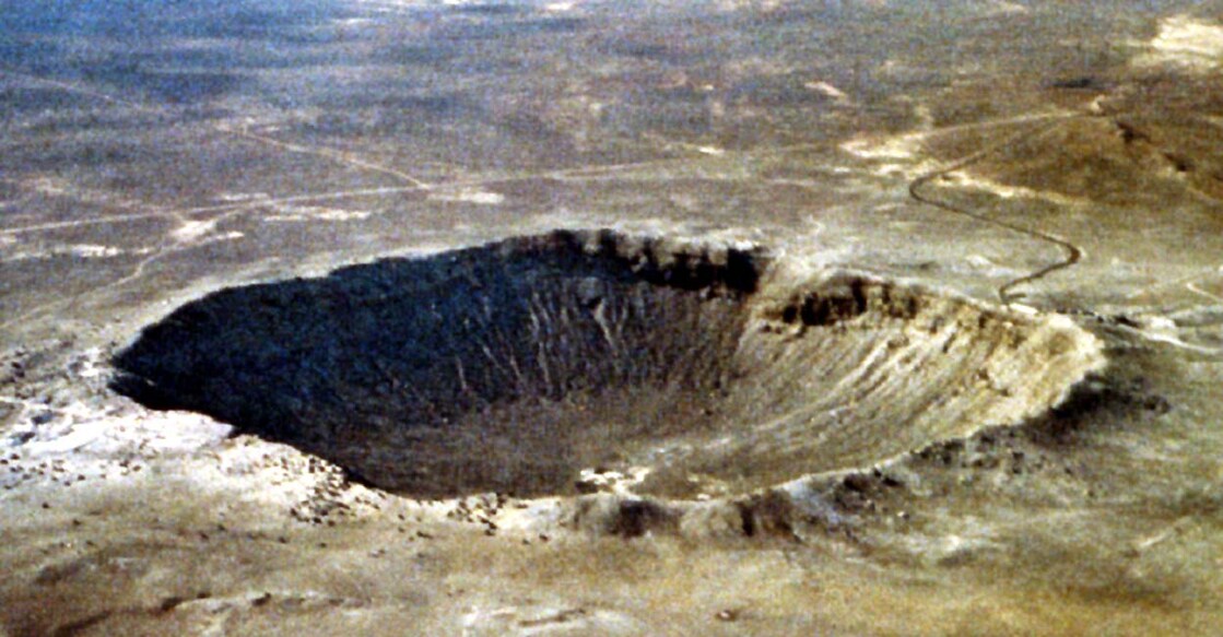 US-ASTEROID-METEOR CRATER യുഎസിലെ അരിസോണയിൽ 49,000 വർഷം മുൻപ് പതിച്ച ആസ്റ്ററോയ്ഡ് സൃഷ്ടിച്ച ഗർത്തം (Photo by HO / NASA / AFP)