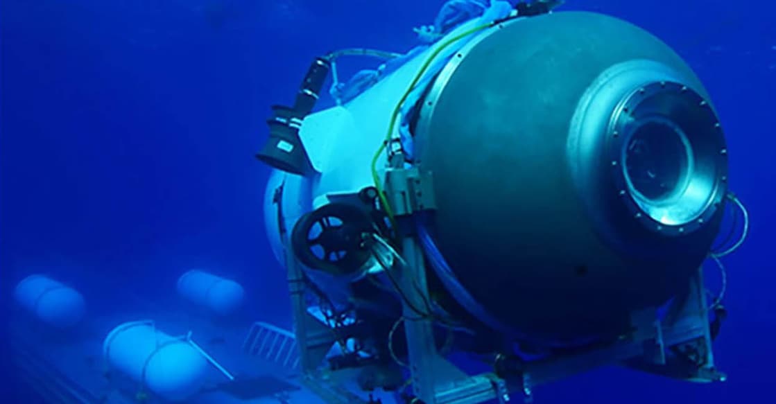 Titan Submersible | (Photo by Handout / OceanGate Expeditions / AFP) ലോഞ്ചിങ് പാഡിൽനിന്ന് കടലിലേക്കു കുതിക്കുന്ന ടൈറ്റൻ സമുദ്രപേടകം. (ഫയൽ ചിത്രം) (Photo by Handout / OceanGate Expeditions / AFP)