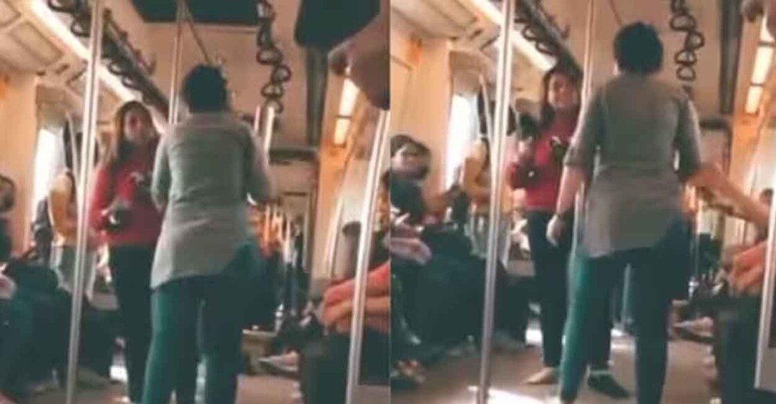 women-abuses-at-each-other-delhi മെട്രോ ട്രെയിനിൽ പരസ്പരം വഴക്കിടുന്ന സ്ത്രീകൾ. Photo: @DeepikaBhardwaj / Twitter