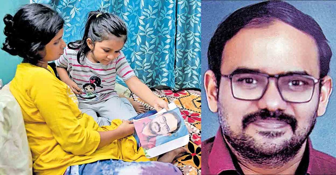nambi-rajesh-and-his-family (1) ഇനിയൊരു ഓർമച്ചിത്രം: മസ്കത്തിൽ മരിച്ച നമ്പി രാജേഷിന്റെ ചിത്രവുമായി ഭാര്യ അമൃത തിരുവനന്തപുരം കരമനയിലെ വീട്ടിൽ. മകൾ അനിക സമീപം. ചിത്രം: റിങ്കുരാജ് മട്ടാഞ്ചേരിയിൽ / മനോരമ (2) നമ്പി രാജേഷ്