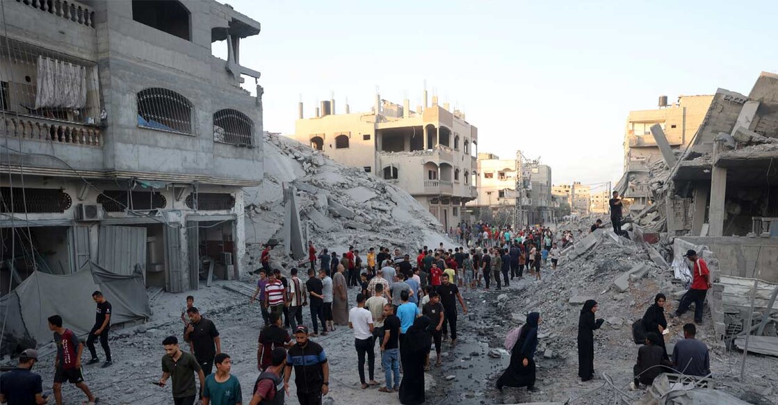israel-attack-gaza-building ഗാസയിൽ ഇസ്രയേൽ ആക്രമണത്തിൽ തകർന്ന കെട്ടിടങ്ങൾ. (Photo by Eyad BABA / AFP)